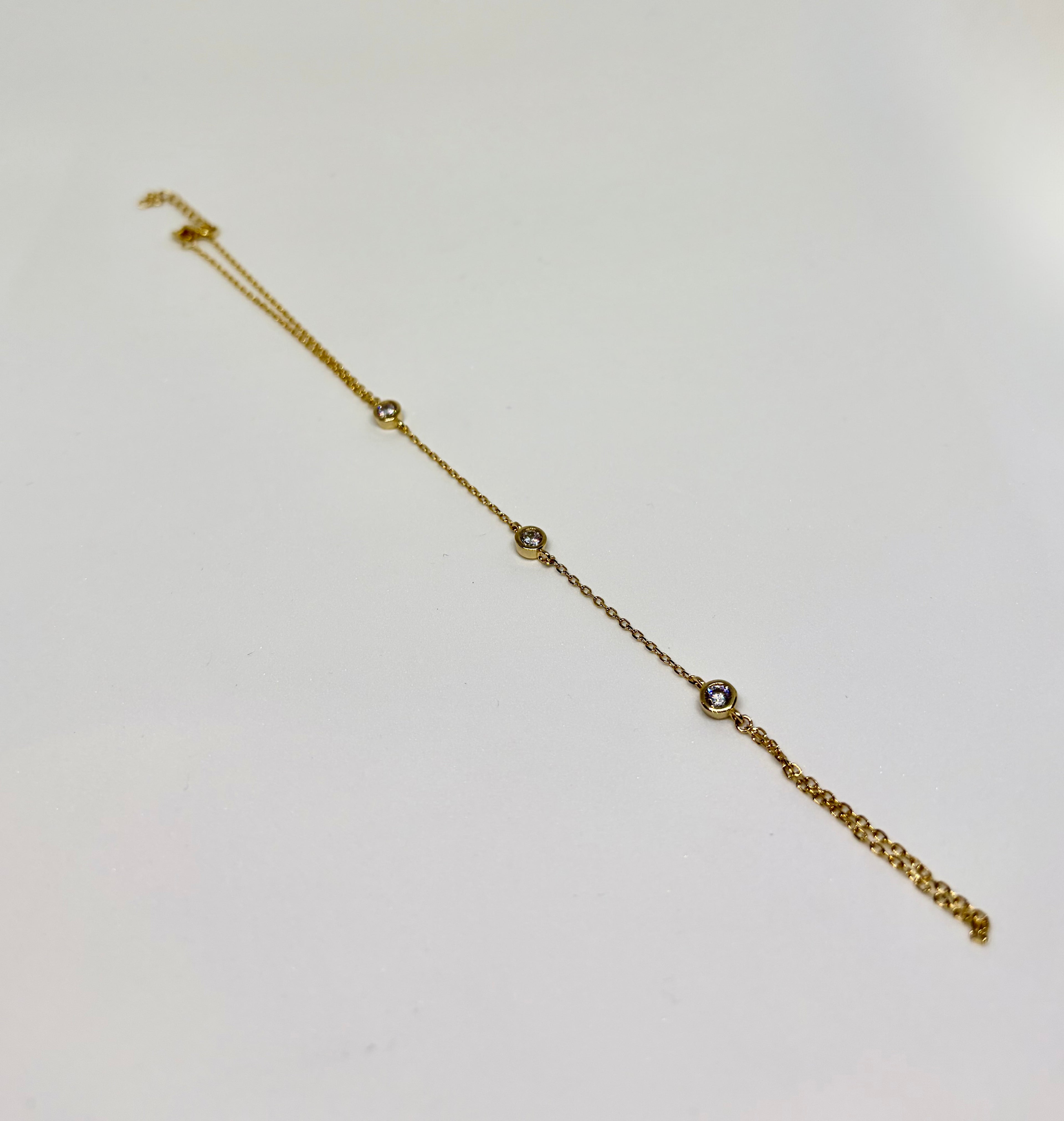 Baciamano con zirconi dorato